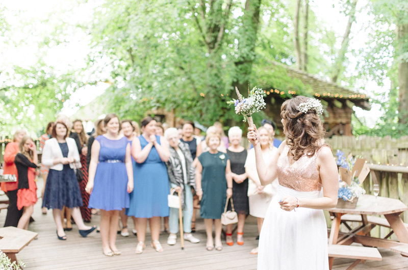 Bride throwing bouquet